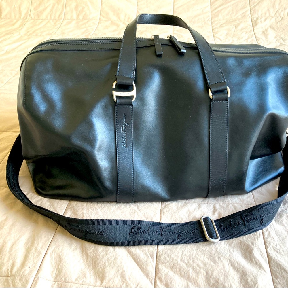 Authentic Salvatore Ferragamo black genuine leather travel bag silver hardware